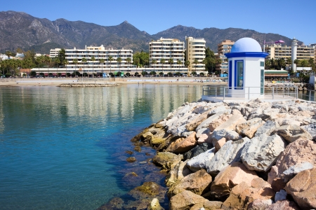 Breakwater on sea bay in popular resort city of Marbella on Costa del Sol in Southern Andalusia, Spain, Malaga province.の写真素材