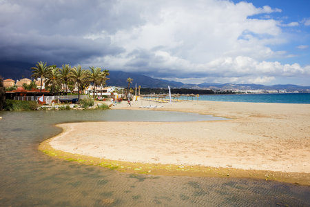 Costa del Sol in Spain, sandy beach located between Marbella and Puerto Banus, waters of Green River (Spanish: Rio Verde) and Mediterranean Sea.のeditorial素材