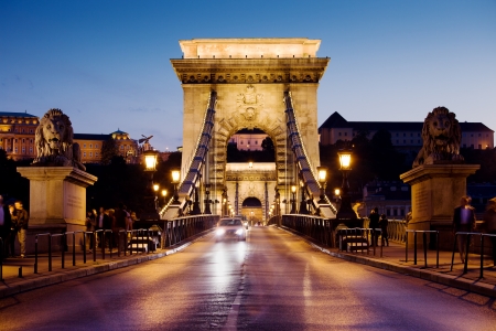 City of Budapest in Hungary night urban scenery, street on the Szechenyi Chain Bridge (Hungarian: Szechenyi lanchid).の写真素材