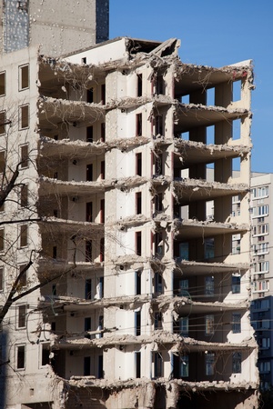 Halfway finished demolishing of a multi-storey old apartment building in Warsaw, Poland.の写真素材