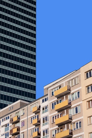 Apartment building and corporate skyscraper in the background, abstract urban scenery in Warsaw...