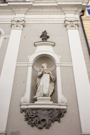 Statue in the exterior niche of St Michael 18th century church in Budapest, Hungary.の写真素材