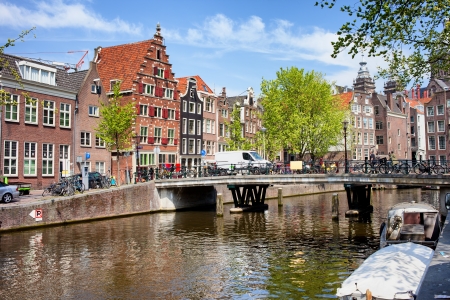 Bridge and traditional Dutch houses on Oudezijds Voorburgwal canal, city of Amsterdam, Netherlands.の写真素材