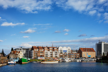 Ships, yachts and apartment buildings in the city of Gdansk, Poland. Marina on the Motlawa river.