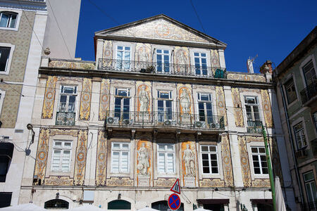 Tiled building from 1863 in Chiado district of Lisbon, Portugal. Figures on facade represents earth, water, science, agriculture, commerce and industry, star at the top symbolizing the Creator of the Universe.の写真素材