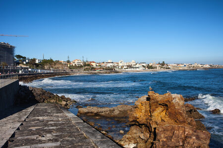 Steps to the Atlantic Ocean and resort town of Estoril skyline in Portugal.の写真素材