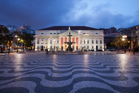 Dona Maria II National Theater on Rossio Square at night, Lisbon, Portugal.のeditorial素材