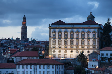 Episcopal Palace and Clerigos Church bell tower at dusk in Porto, Portugal.のeditorial素材