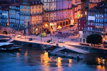 City of Porto in Portugal at dusk, historic houses by the Douro river in the Old Town.の写真素材