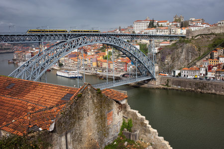 City of Porto in Portugal, view from Vila Nova de Gaia, Dom Luis I Bridge over Douro river and the Old Town.のeditorial素材