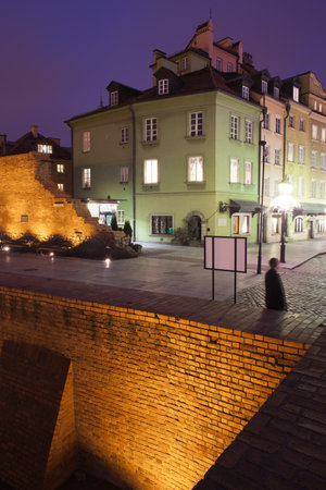 Poland, Warsaw, Old Town by night, city wall and tenement housesのeditorial素材