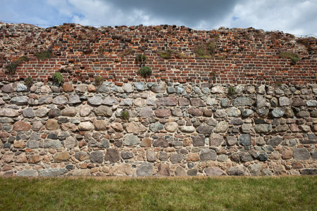 Teutonic Knights Castle wall background in Torun, Poland, stone and brick medieval fortification.のeditorial素材