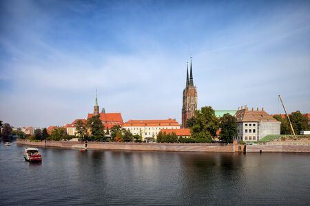 Poland, city of Wroclaw, Ostrow Tumski skyline at Odra (Oder) river waterfront.の写真素材