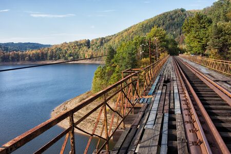 Old steel truss railway bridge over the Pilchowickie Lake, Poland.の写真素材