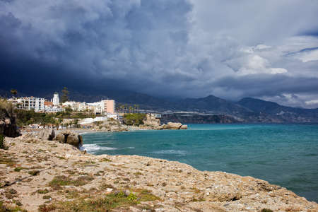 Stormy sky above coastline of Mediterranean Sea, Costa del Sol, Nerja, Spainの写真素材