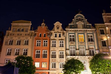 Poland, city of Gdansk, Old Town, gabled tenement houses at nightの写真素材