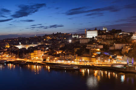 Porto cityscape by night in Portugal, historic city centre, Old Town at Douro Riverの写真素材