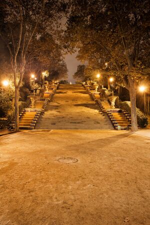 Stairway to Montjuic Hill at night in Barcelona, Spain, Passeig de Jean Forestierの写真素材