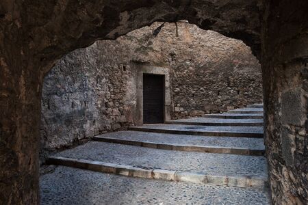 Medieval passage with stairs in Old Jewish Quarter, city of Girona in Catalonia, Spainの写真素材