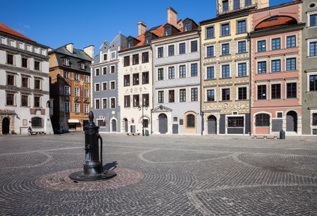 City of Warsaw in Poland, Old Town Market Square (Polish: Rynek Starego Miasta), historic houses and water pump on cobbled plazaのeditorial素材