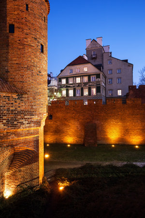 Warsaw in Poland, Old Town in the evening, houses and city wall fortificationのeditorial素材