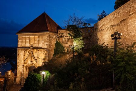 Slovakia, Bratislava, Sigismund Gate and wall of Bratislava Castle lit up at night, 15th century fortification.の写真素材