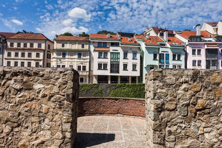 City of Bratislava in Slovakia, row of apartment houses behind old city stone wall of the Old Town.の写真素材