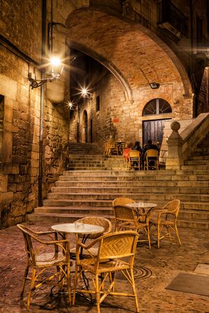 City of Girona at night, Pujada de Sant Domenec stairs and Arch of the Agullana Palace in Old Town, Catalonia, Spainの写真素材