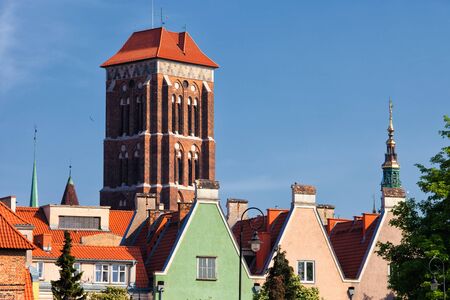 City of Gdansk in Poland, Old Town urban scenery, tower of the St. Mary's Church and houses with...