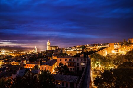 Twilight cityscape of Girona city, picturesque urban landscape in Catalonia, Spain.の写真素材