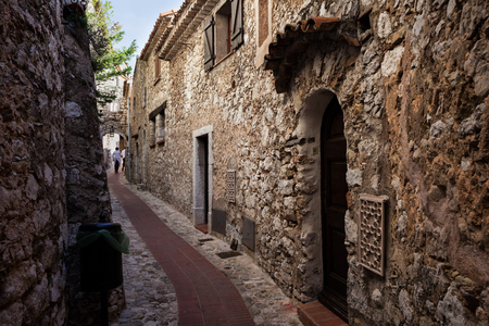 Narrow alley and old stone houses in Eze village in Franceの写真素材