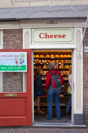 Amsterdam, Holland, Netherlands - May 09, 2013: tourists in cheese shop with good variety shopping...