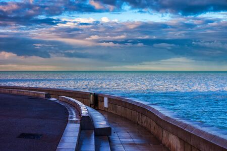 French Riviera waterfront at sunrise along Mediterranean Sea in city of Nice in Franceの写真素材