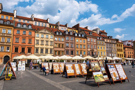 Warsaw, Poland - May 25, 2019: Historic houses and paintings for sale on Old Town Market Square, UNESCO World Heritage Site in the capital cityのeditorial素材