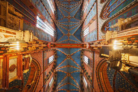 Krakow, Poland - September 20, 2014: St. Mary's Basilica - Mariacki Church interior, cross vault ribbed roof painted as sky with stars, Gothic 14th century architecture, cty landmark.のeditorial素材
