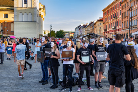 Warsaw, Poland - August 24, 2019: People from Anonymous for the Voiceless (AV) animal rights organization in Cube of Truth, peaceful demonstration at the Old Town square of capital cityのeditorial素材