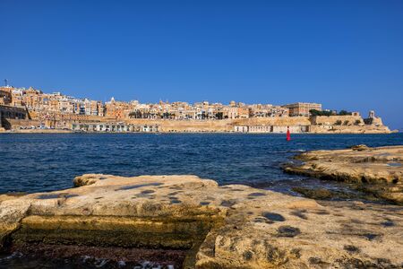 City skyline of Valletta in Malta, view from old shore in Birgu (Vittoriosa) at the Grand Harbour.の写真素材