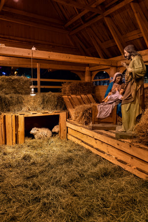 Warsaw, Poland - December 27, 2019: Nativity Scene Christmas crib with baby Jesus, saint Mary and Joseph and sheeps, public exhibition in the cityのeditorial素材