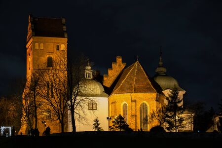 Gothic Church of the Visitation of the Blessed Virgin Mary illuminated at night in Warsaw, Polandの写真素材