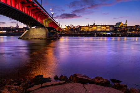 River view of Warsaw Old Town at evening twilight, capital city of Poland, illuminated bridge and the Royal Castleのeditorial素材