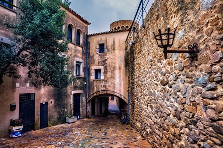 Vila Vella â Old Town of Tossa de Mar on Costa Brava in Catalonia, Spain, medieval stone wall, houses and cobblestone street.の写真素材