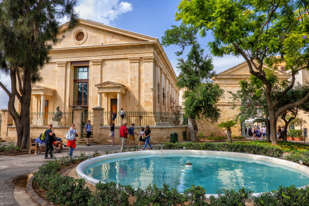 Valletta, Malta - October 10, 2019: Upper Barrakka Gardens, garden with fountain and former Garrison Chapel, city landmarkのeditorial素材