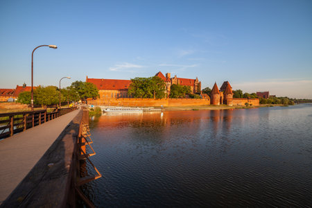 Malbork Castle at sunset in Poland, river view.のeditorial素材