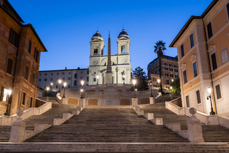 Spanish Steps in city of Rome at dawn in Italy, Trinita dei Monti church above.の写真素材