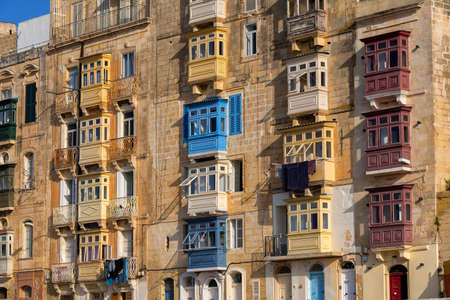 Old city of Valletta in Malta, traditional Maltese houses with enclosed wooden balconiesの写真素材