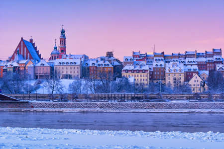 City of Warsaw in Poland on winter dawn, skyline of the Old Townの写真素材