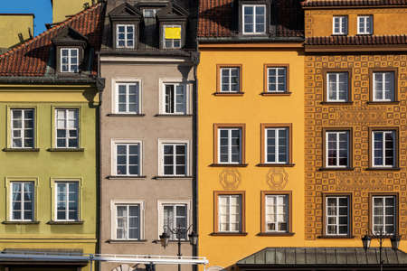 Colorful facades of historic tenement houses in the Old Town of Warsaw city in Poland.の写真素材