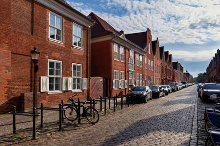 City of Potsdam in Germany, traditional red brick houses along cobbled city street in the Dutch Quarter, city landmark.の写真素材