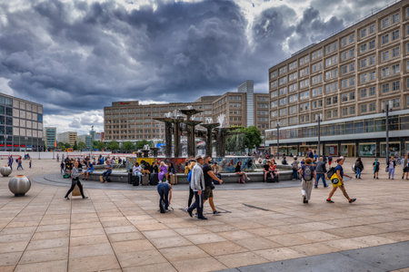 Berlin, Germany - August 2, 2021: People on the Alexanderplatz city square with Fountain of Friendship, central Mitte districtのeditorial素材