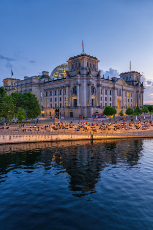 Berlin, Germany - August 4, 2021: Reichstag building at dusk from the river Spree, city landmark.のeditorial素材
